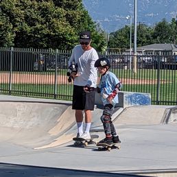 Coach Chris lends a hand as he gets comfortable cruising around the park.