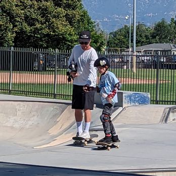 Pacific Skate School - Coach Chris lends a hand as he gets comfortable cruising around the park. - Skate Parks Near Me - Burbank, California