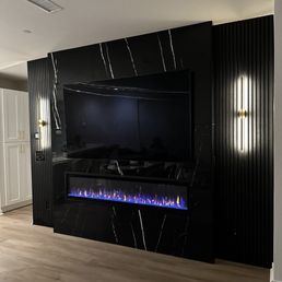 Custom media wall and linen closet