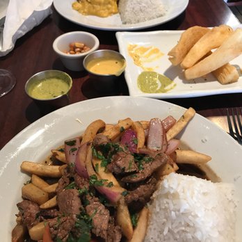 El Chullo Peruvian Restaurant & Bar - Lomo saltado in the front; yucca appetizer in the background - Peruvian Near Me - Phoenix, Arizona El Chullo Peruvian Restaurant & Bar - Lomo saltado in the front; yucca appetizer in the background - Peruvian Near Me - Phoenix, Arizona