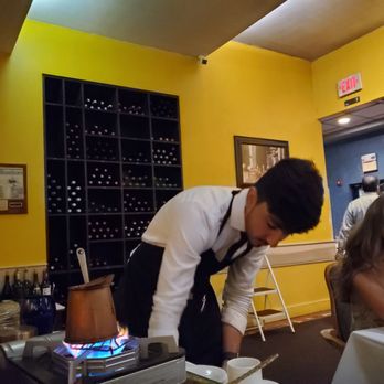 The Helmand Restaurant - Our server preparing coffee after dinner in a traditional Afghani way - Afghan Near Me - Cambridge, Massachusetts The Helmand Restaurant - Our server preparing coffee after dinner in a traditional Afghani way - Afghan Near Me - Cambridge, Massachusetts