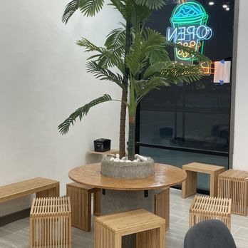 Ann’s Teahouse - a table with benches and a potted plant - Vietnamese Near Me - Houston, Texas Ann’s Teahouse - a table with benches and a potted plant - Vietnamese Near Me - Houston, Texas