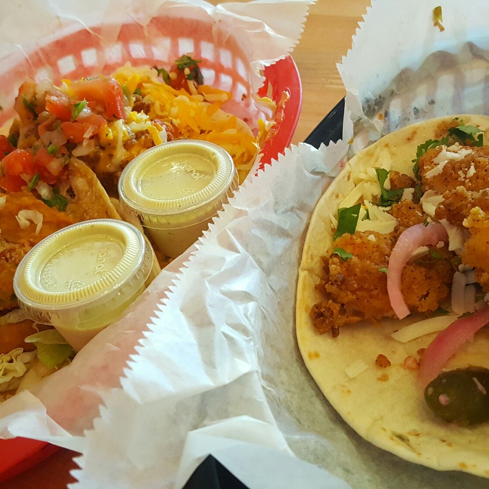 Torchy's Tacos - On the right is the Baja Shrimp taco. Top left is the Trailer Park taco (trashy of course) and then the Fried Avocado taco below! - Tex-Mex Near Me - Denver, Colorado Torchy's Tacos - On the right is the Baja Shrimp taco. Top left is the Trailer Park taco (trashy of course) and then the Fried Avocado taco below! - Tex-Mex Near Me - Denver, Colorado