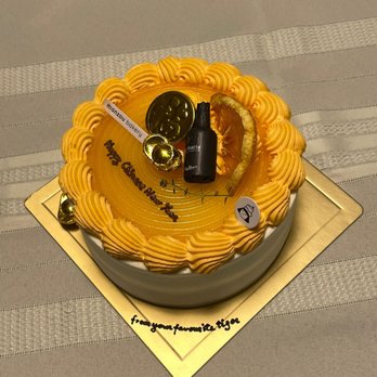 Manzou Bakery - Special order of an orange cream cake for Chinese New Year. Great presentation. Full of fortune and luck - Bakeries Near Me - Toronto, Ontario