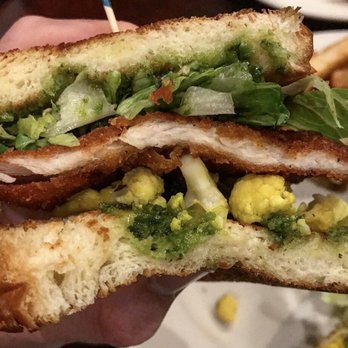 Perly's - Shapiro Schnitzel : toasted challah w/ shredded lettuce, bread & butter pickled cauliflower, chicken schnitzel and skhug chili pepper sauce. - Delis Near Me - Richmond, Virginia