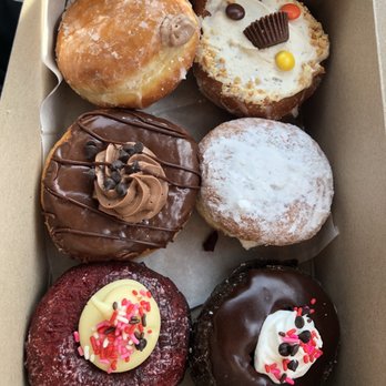 Donuts Delite - Starting from top left and clockwise: Chocolate cream, PB cup, Cannoli, chocolate cake, red velvet, chocolate frosted with cream inside - Donuts Near Me - Rochester, New York