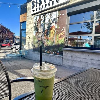 Sisters Coffee - The Old Mill - Matcha latte on the patio Sisters Coffee. - Coffee & Tea Near Me - Bend, Oregon