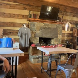 1800s log cabin filled with fun games and delicious cider