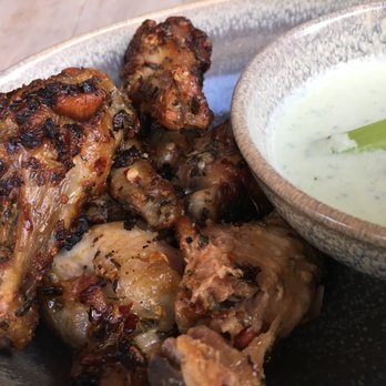 Moku Kitchen - Wood Roasted Wings ($14): the price of admission for 7 wings is steep...unless it's Happy Hour :) - Cocktail Bars Near Me - Honolulu, Hawaii