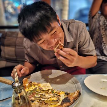 Rigo - Pizza Bismark - served with a raw egg yolk. Coincidentally, son's choice and server's recommendation. - Spanish Near Me - Honolulu, Hawaii Rigo - Pizza Bismark - served with a raw egg yolk. Coincidentally, son's choice and server's recommendation. - Spanish Near Me - Honolulu, Hawaii