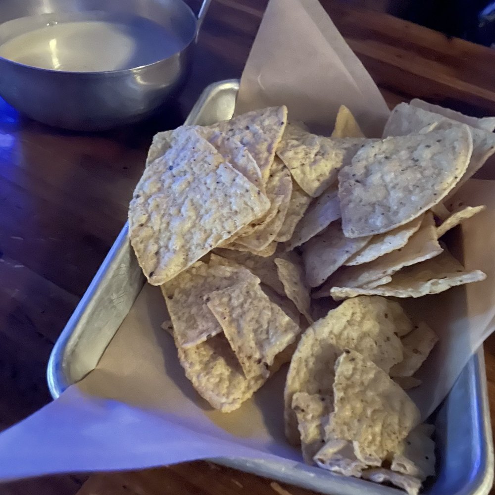 The Brick Bar - a bowl of chips and a bowl of dip - Cocktail Bars Near Me - Toledo, Ohio