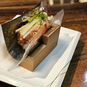 Wasabi - a sandwich wrapped in plastic on a plate - Sushi Bars Near Me - Honolulu, Hawaii Wasabi - a sandwich wrapped in plastic on a plate - Sushi Bars Near Me - Honolulu, Hawaii