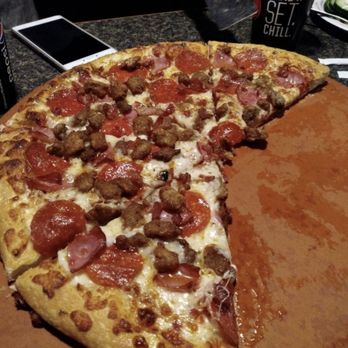 Pizza Hut - a half eaten pizza with a slice missing - Pizza Near Me - Moab, Utah