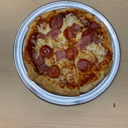 Pineapple pepperoni ham pizza. Workers don't have pride in their job and you can see it in this photo!