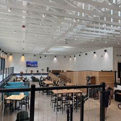 Three Fins Coffee & Cacao Factory - Swimming pool turned indoor seating area