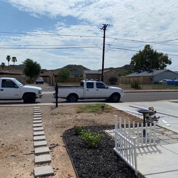 Tile Insulation Company - a white pickup truck parked on the side of the road - Flooring Near Me