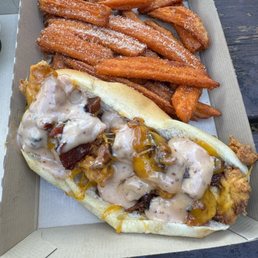 Chicken sandwich with an amazing signature sauce and sweet potato fries!