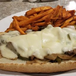 Vegetarian special order: Philly "no steak" cheese and veggies sandwich with sweet potato fries and pickle spear. Vegetarian special order: Philly "no steak" cheese and veggies sandwich with sweet potato fries and pickle spear.