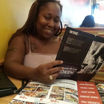 Applebee's Grill + Bar - Friend reviewing the menu. - Sports Bars Near Me - Chula Vista, California Applebee's Grill + Bar - Friend reviewing the menu. - Sports Bars Near Me - Chula Vista, California