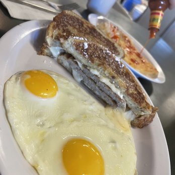 Hudy's Cafe & The Li'l Bar - Stuffed French Toast with sausage, side of hash browns, and sunny-side up eggs! - Cafes Near Me - Champlin, Minnesota Hudy's Cafe & The Li'l Bar - Stuffed French Toast with sausage, side of hash browns, and sunny-side up eggs! - Cafes Near Me - Champlin, Minnesota