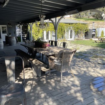 Strange Family Vineyards - Shaded large family style table. - Wine Tasting Room Near Me - Lompoc, California