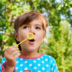 Rob Sirota Photography - Young child blowing bubbles