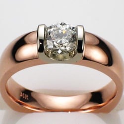 14 Karats Exquisite Custom Jewelry - 14 karat Rose Gold saddle ring with 0.56 carat round brilliant diamond in platinum saddle.