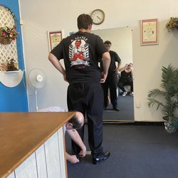 Pete's Tailor Shop - Pete measuring