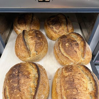 Cultured - a bunch of freshly baked bread in an oven - Bakeries Near Me - Sister Bay, Wisconsin Cultured - a bunch of freshly baked bread in an oven - Bakeries Near Me - Sister Bay, Wisconsin