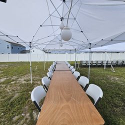 Hometown Amusement And Creations - 10 x 20 popup tent with tables and chairs