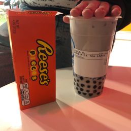 a cup of bubble tea and a box of cereal