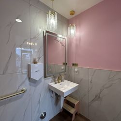 Bathroom includes stool for children