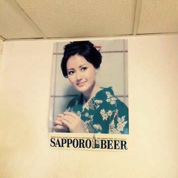 Oriental Shop - A classic Sapporo beer sign, part of the familiar decorations here for years. - International Grocery Near Me - Madison, Wisconsin