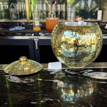 Chéri Rooftop - Large cocktails to share. Disco ball in front It Bag in the back - Lounges Near Me - Las Vegas, Nevada