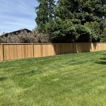 Optima Fence and Deck - Estate fence with faux post placed on 10' intervals and internal treated post on 8' intervals. Boards are screwed - Fences & Gates Near Me - Mercer Island, Washington Optima Fence and Deck - Estate fence with faux post placed on 10' intervals and internal treated post on 8' intervals. Boards are screwed - Fences & Gates Near Me - Mercer Island, Washington