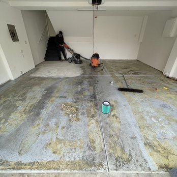 Elite Epoxy Solutions - Adam on the grinder giving the concrete a heavy grind while removing glue from a carpet glued down I did myself. - Flooring Near Me Elite Epoxy Solutions - Adam on the grinder giving the concrete a heavy grind while removing glue from a carpet glued down I did myself. - Flooring Near Me