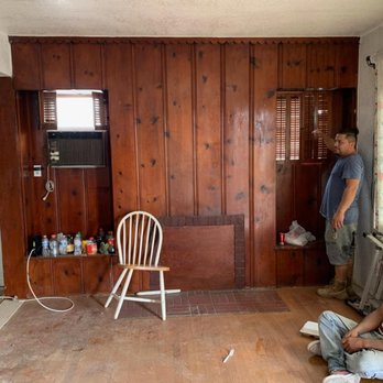 Pure Energy Construction - This is the before picture of the brown paneling on the living room wall. You can't even see that there are windows on this wall. - General Contractors Near Me - Northridge, California Pure Energy Construction - This is the before picture of the brown paneling on the living room wall. You can't even see that there are windows on this wall. - General Contractors Near Me - Northridge, California