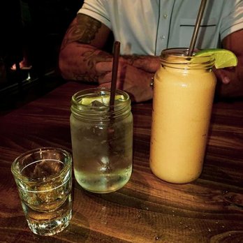Midtown Spirits - Cucumber Lime Infused Vodka, Club Soda and a POG (Pineapple Orange Guava) slush. - Bars Near Me - Sacramento, California Midtown Spirits - Cucumber Lime Infused Vodka, Club Soda and a POG (Pineapple Orange Guava) slush. - Bars Near Me - Sacramento, California