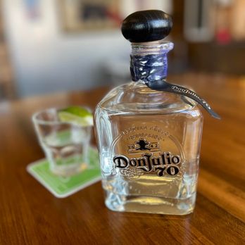 Trailside Tavern - a bottle of tequila next to a shot glass - Burgers Near Me - Crosby, Minnesota Trailside Tavern - a bottle of tequila next to a shot glass - Burgers Near Me - Crosby, Minnesota