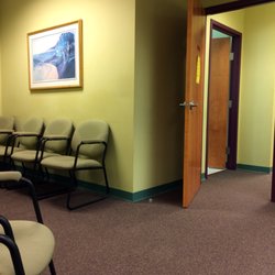 Reiter, Hill & Johnson - Waiting area, with one of two entrances into the treatment area. Everything is very clean and minimal.