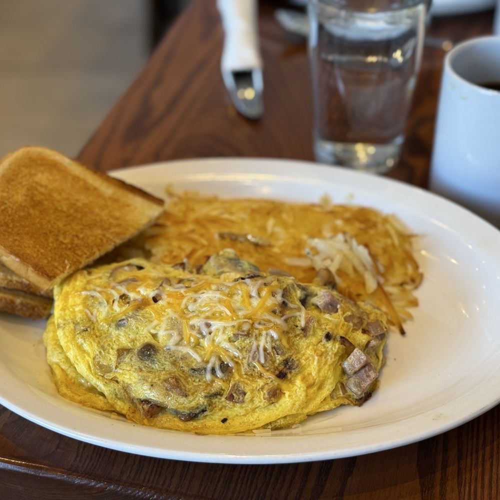 Sunrise Omelette with sourdough bread and hashbrowns. Yummy! Sunrise Omelette with sourdough bread and hashbrowns. Yummy!