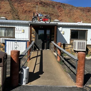 Silver Sage Inn - Exterior entrance in the morning (enter under the rooftop motorcycle) - Hotels Near Me - Moab, Utah