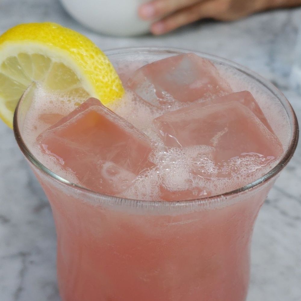 Culinary Dropout - Between you and me drink. Tastes like a Delicious adult lemonade - New American Near Me - Austin, Texas
