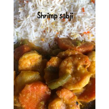 Polash - a plate of food with rice and shrimp - Indian Near Me - New York, New York Polash - a plate of food with rice and shrimp - Indian Near Me - New York, New York