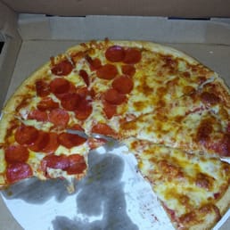 a half eaten pepperoni pizza