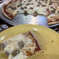 Yellow Dog Cafe & Bar - Pizza with sausage and onions.