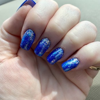 Anne at Solutions day spa - Blue nails with glitter - Hair Salons Near Me - Conway, Arkansas
