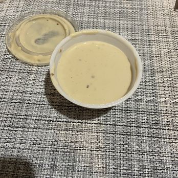 Pollo Tropical - Salad dressing instead of the cilantro garlic I ordered - Latin American Near Me - Miami, Florida