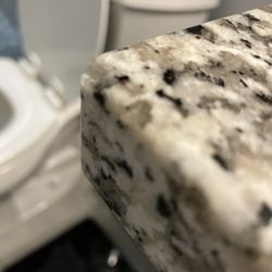 DK Stone - Tiny chip out of the corner. Difficult to see.