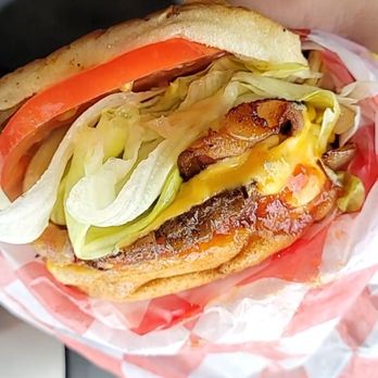 King Chicken Drive-In - a person holding a sandwich in their hand - Soul Food Near Me - Washington, North Carolina